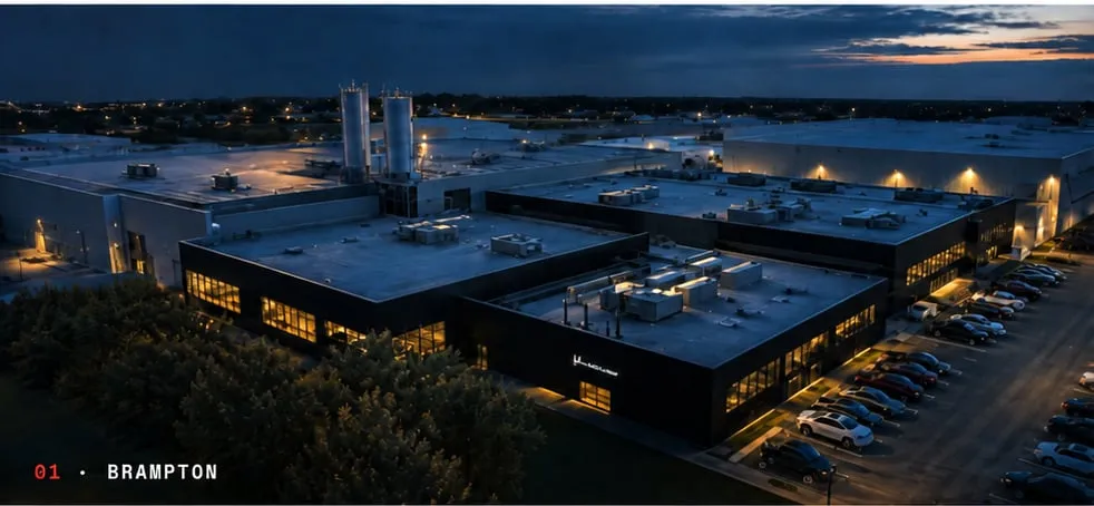 01 · Brampton — Lucid manufacturing facility at dusk